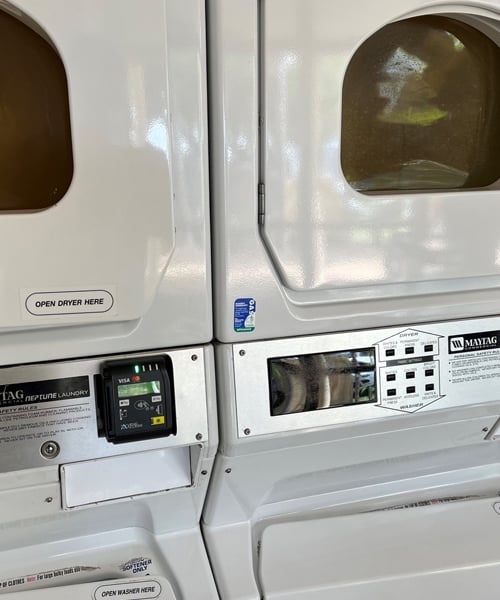 A dryer machine with card reader.